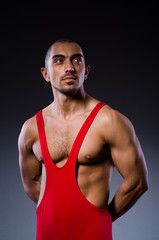 Fototapeta premium Young wrestler isolated on the white