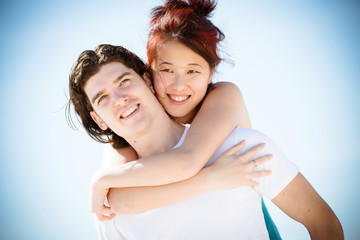 Young Couple Embraced in a Caribbean Beach