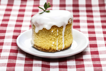 Glazed easter cake on squared table cloth