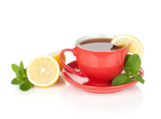 Red tea cup with lemon and mint