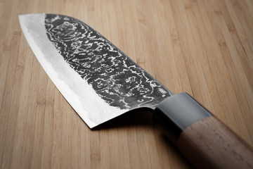 Grungy image of damascus steel kitchen knife