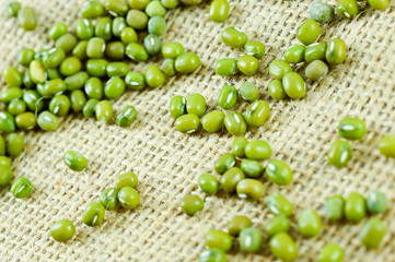 Grains of wheat on the sacks background.