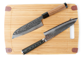 Two expensive japanese knives on cutting board