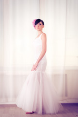 beautiful young girl in a wedding dress close-up