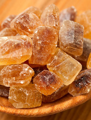 brown caramelized sugar on wooden background