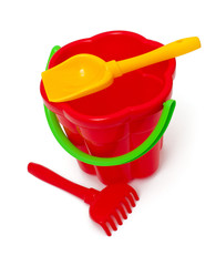 play set with bucket, shovel and rake on white