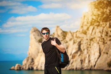 tourist is locking for a way from the rocks top