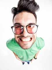 funny handsome man with hipster glasses smiling  - wide angle
