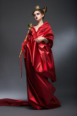 Magic. Woman Wizard in Red Pallium with Scepter. Witchcraft - obrazy, fototapety, plakaty