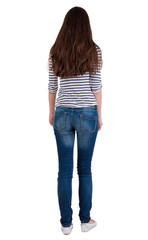 Obraz premium back view of standing young beautiful brunette woman.