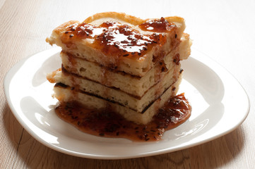 A stack of pancakes with jam gooseberry