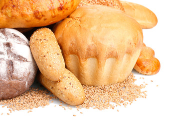 delicious breads and wheat isolated on white