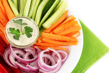 Assorted raw vegetables sticks in plate close up