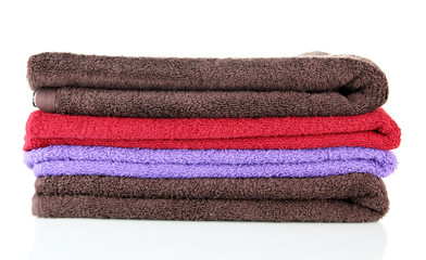 Fototapeta na wymiar Pile of colorful towels, isolated on white