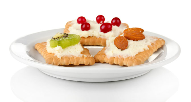 Tasty canapes with cheese, kiwi and cranberry, almond,