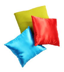 Three  bright pillows isolated on white