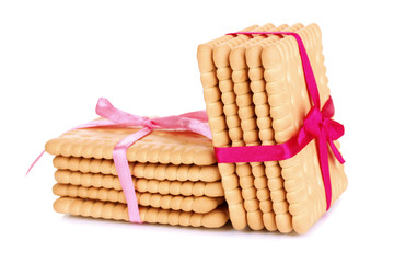 Sweet cookies tied with pink ribbons isolated on white