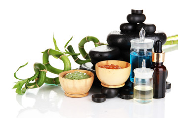 Spas composition with oils and spa stones isolated on white