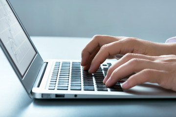 Businessman typing on laptop