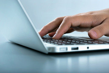 Businessman typing on laptop