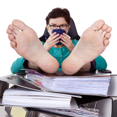 Office woman puts feet up relaxing