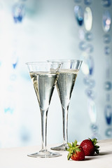 Two glasses of champagne with strawberries