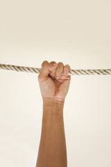 hang on rope,male hand grab a rope hang on tight