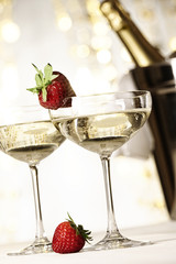 Two glasses of champagne with strawberries