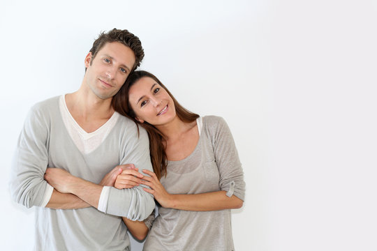 Young Couple Standing On White Background