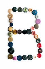 Letter alphabet formed of buttons