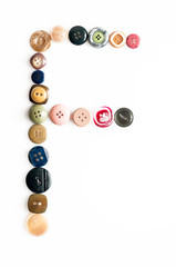 Letter alphabet formed of buttons