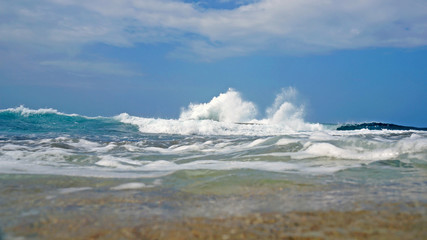 Wave crashing seen from water surface, Caribbean sea, Costa Rica