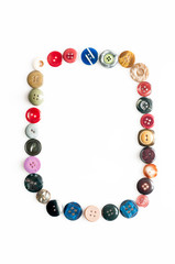Letter alphabet formed of buttons
