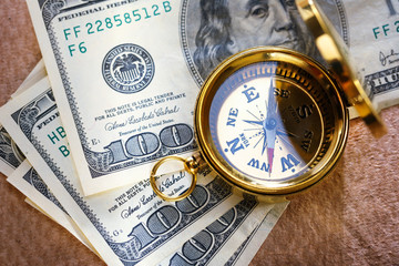 Golden vintage compass and money