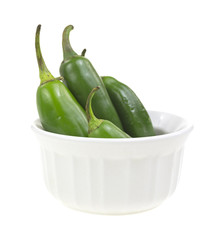 Jalapeno peppers in small white dish