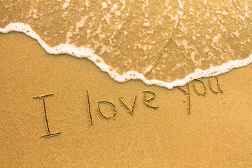 I love you - inscription on the beach sand