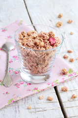 Berry muesli on rusted wooden table