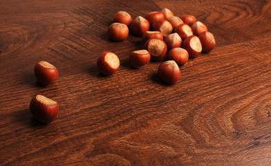 Hazelnuts on wood background