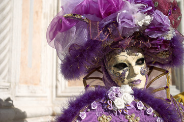 Venetian costume attends Carnival of Venice.