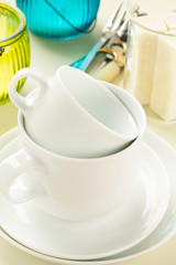 Stack of white ceramic coffee cups