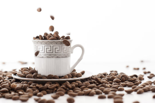 coffee cores falls in to a coffee cup