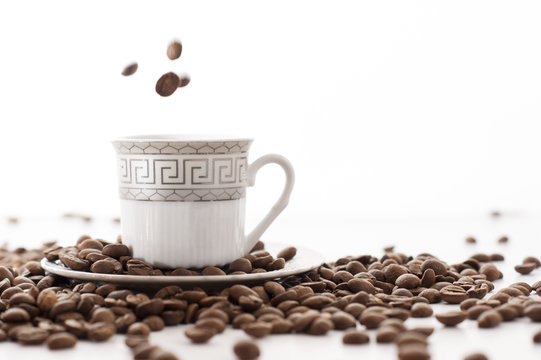coffee cores falls in to a coffee cup