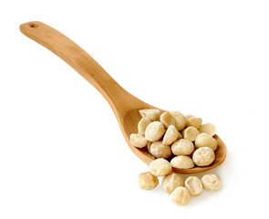 macadamia nuts in wooden spoon