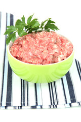 Bowl of raw ground meat isolated on white