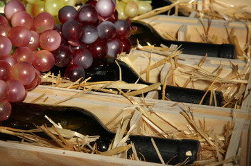 Wooden case with wine bottles close up