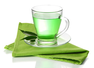 Transparent cup of green tea on napkin, isolated on white