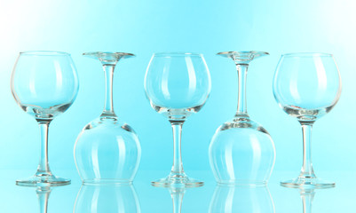 Glasses on light blue background