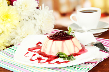 Panna Cotta with raspberry sauce, on bright background