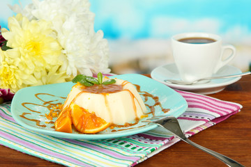 Panna Cotta with orange zest and caramel sauce,