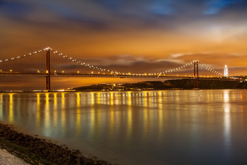 25 de Abril bridge over Tagus river in Lisbon at night